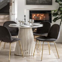 round dining table with a tapered slatted wooden base finished in a white wash and completed with a white Indian marble table top