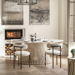 oval dining table with a tapered slatted wooden base finished in a sand blasted white wash and completed with a white Indian marble table top