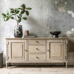 handcrafted oak sideboard with two shelved cupboards and three drawers, bobbin turned legs and a lime wash finish