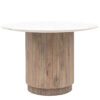 round dining table with a ribbed, drum shaped, base crafted from mango wood and topped with Indian white marble