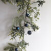 long faux pine and eucalyptus Christmas garland with blue baubles