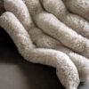luxuriously soft natural chunky ribbed faux fur throw with plain reverse
