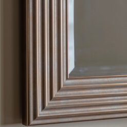 decorative rectangle wall mirror with a stepped ribbed wide frame and antique gold finish