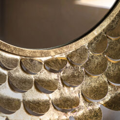 decorative round wall mirror with a deep metal frame made up of layers of cut out petals finished in a gold leaf