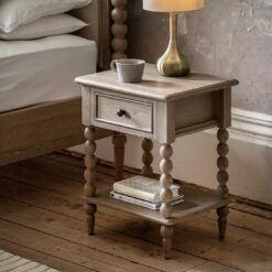 handcrafted oak bedside table with bobbin turned legs and a white wash finish, with one drawer and lower shelf