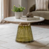 round coffee table with a fluted glass pedestal base finish in olive green with brass accents and complete with a round white marble tabletop with subtle veining