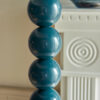 stick metal floor lamp base with bobbin detailing finished in a deep teal blue and matching fabric cord