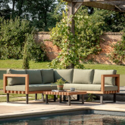 olive green outdoor corner sofa set crafted from eucalyptus wood with a chunky contemporary frame, metal powder coated legs and olive green cushions - complete with a slatted wooden coffee table