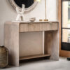 two drawer mango wood console table with a curved silhouette, fluted drawer fronts with brass handles and lower shelf