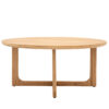 round oak coffee table with sculpted underframe
