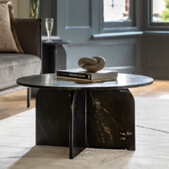 solid round black marble coffee table with a striking arched base