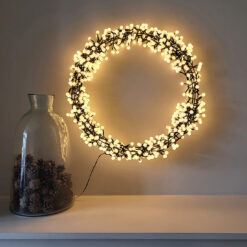 pre-lit mains operated large wired christmas wreath adorned in snowberry warm white LED lights