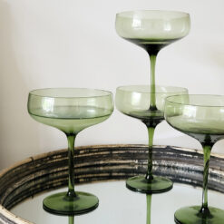 set of four elegant champagne coupes in an olive green hue