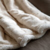 cosy cream sherpa throw with embossed christmas tree design