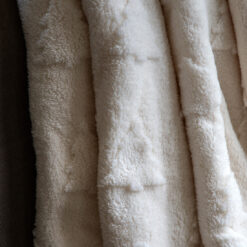 cosy cream sherpa throw with embossed christmas tree design