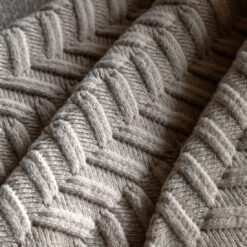 luxurious herringbone cosy knitted throw in a natural oatmeal