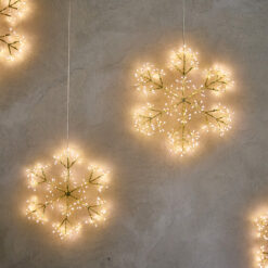 champagne gold lit hanging snowflake decoration available in two sizes with warm white LED lights and mains operated